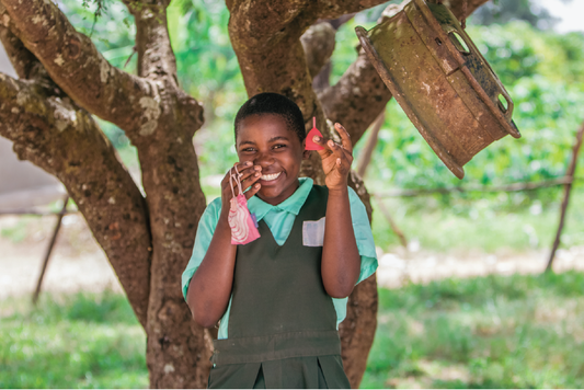 Girl holding Saalt menstrual cup