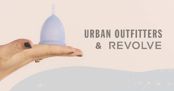 Hand balancing cup and logos of Urban Outfitters and Revolve.