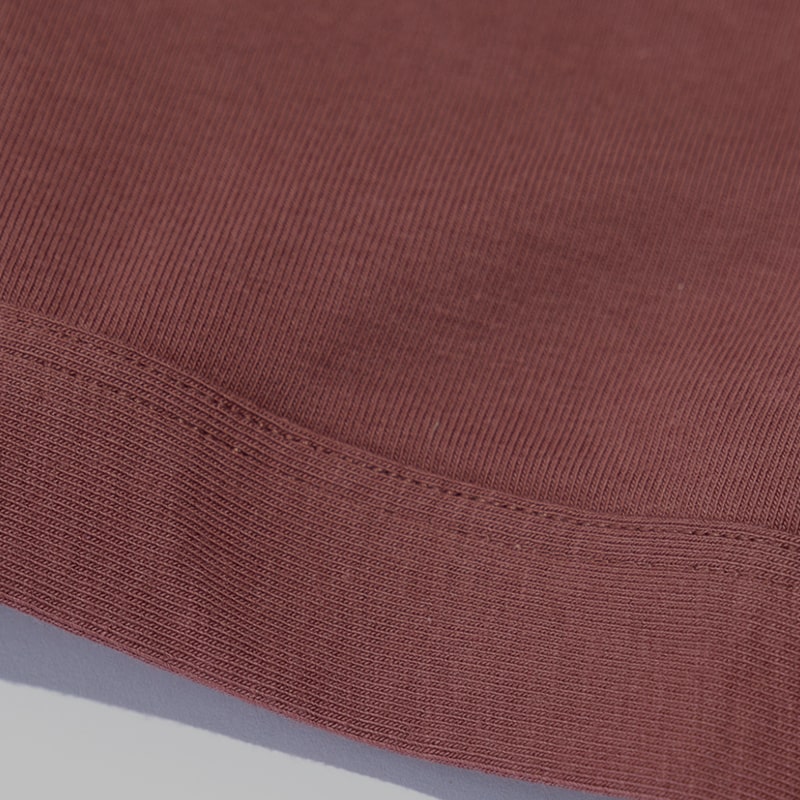 Closeup showing Saalt's Cotton fabric in color Red Hibiscus.